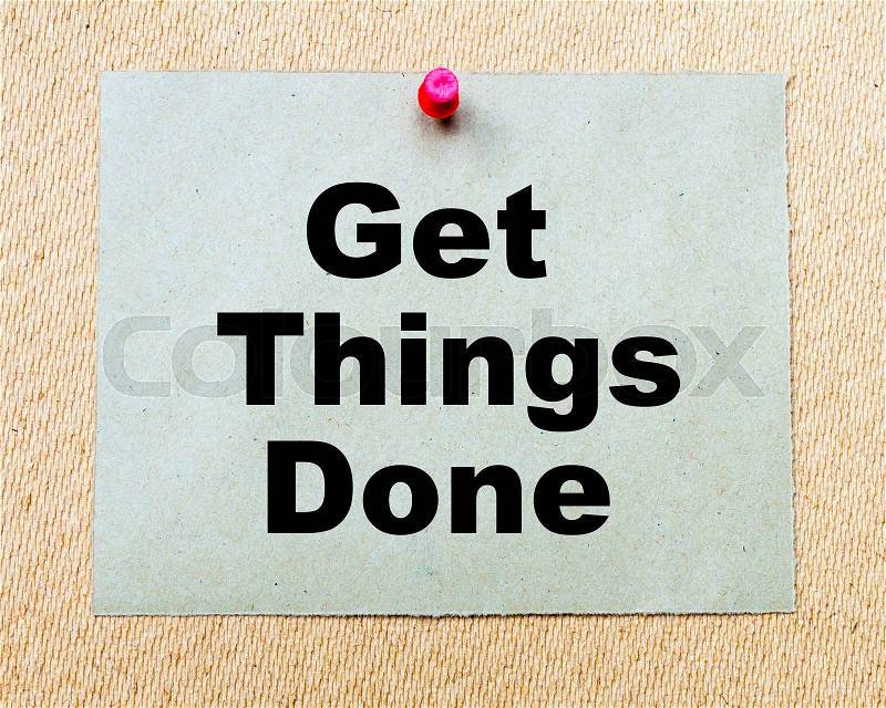 Get Things Done written on paper note pinned with red thumbtack on wooden board. Business conceptual Image, stock photo