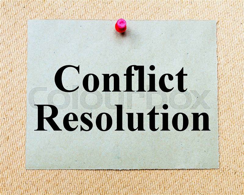 Conflict Resolution written on paper note pinned with red thumbtack on wooden board. Business conceptual Image, stock photo