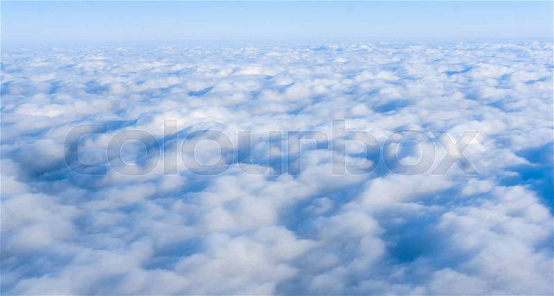 Skyline view from airplane window. Clouds. Sky and clouds, stock photo