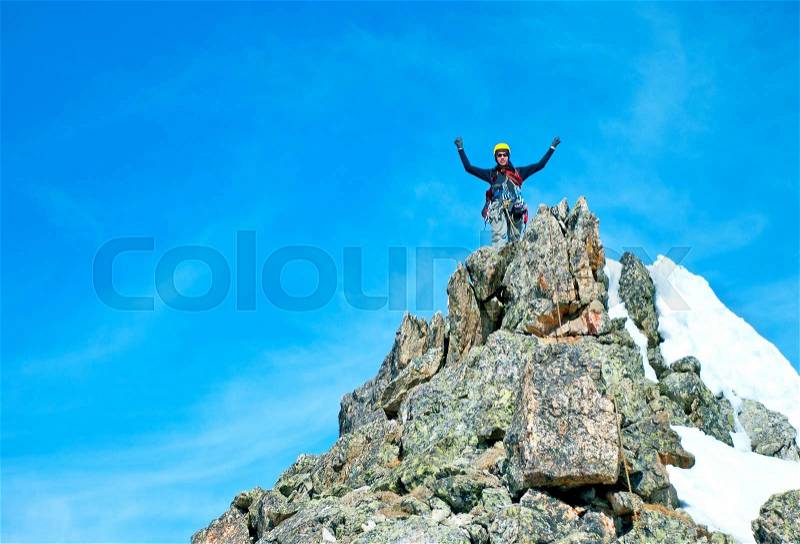 The rock-climber on theThe rock-climber on the summit summit, stock photo