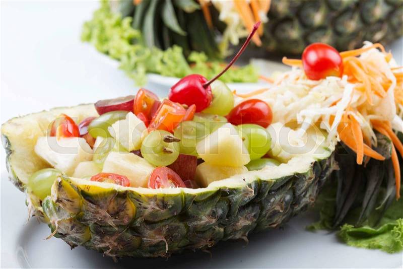 Close up Fruit Salad in Pineapple on the plate, stock photo