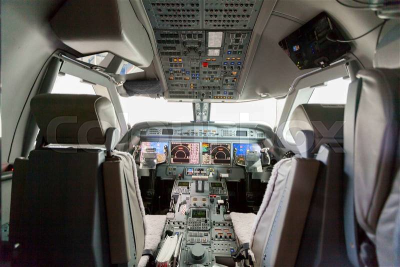 Inside view Cockpit G550 with blue sky and clouds, stock photo
