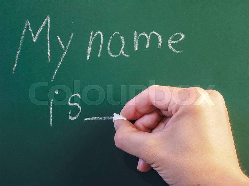 Teacher writing on green chalkboard: My name is, stock photo