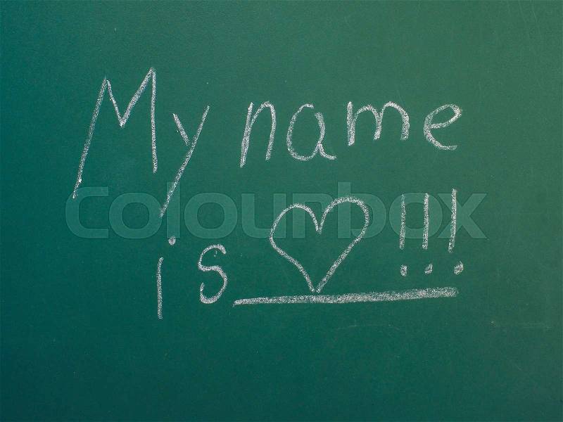 My name is love, written in white chalk on green chalkboard, stock photo