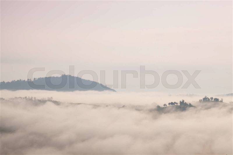 Fog covered mountains and forest in the morning. Northern Thailand is cold and cool in the morning, stock photo