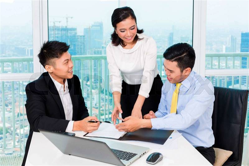 Asian banker counseling client finance investment in bank office , stock photo