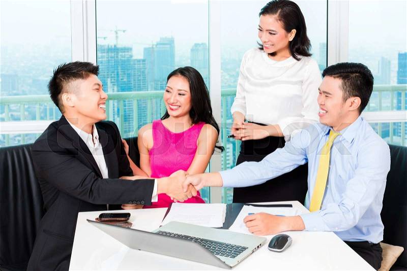 Asian banker team counseling client finance investment in bank office , stock photo