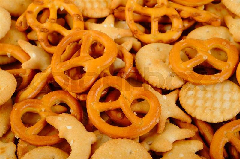 Salty cracker and pretzel on background, stock photo