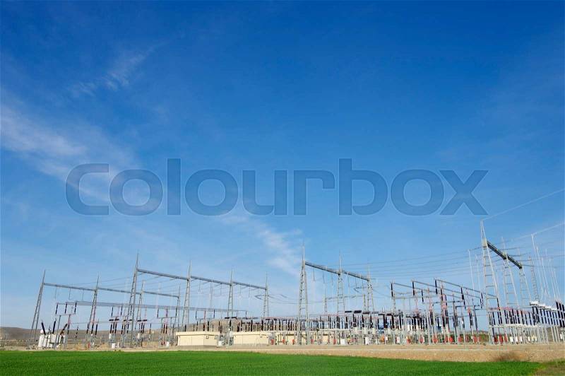 View of an electrical substation and a high voltage electric line, stock photo