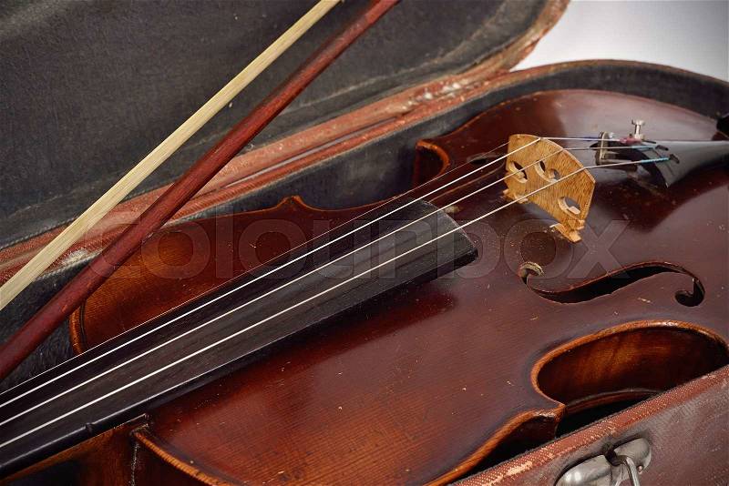 Antique fiddle case and violin, close up, stock photo