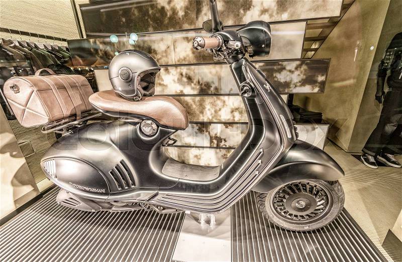 FORTE DEI MARMI, ITALY - JUNE 20, 2015: Old Vespa motorbike in Armani Store. Vespa is a very common italian scooter, stock photo