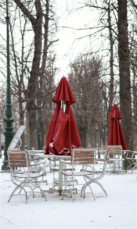 Empty street cafe in Paris at winter, stock photo