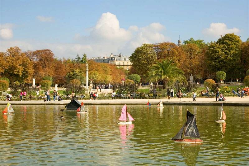 Toy boats in the Luxembourg Garden of Paris, France. The pirate boat on the first plan, stock photo