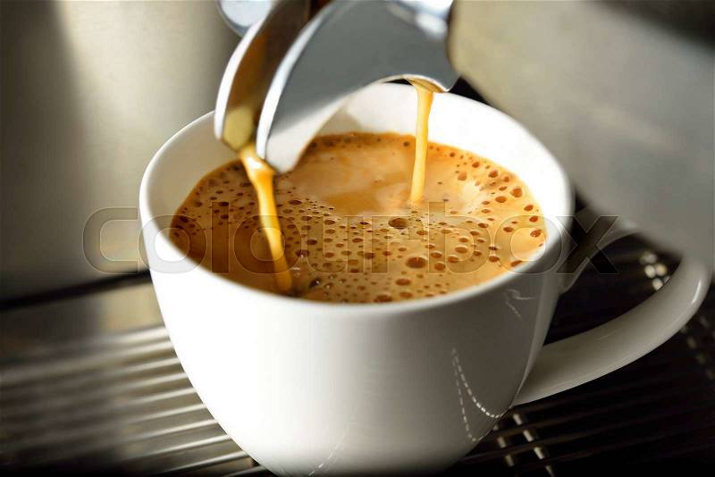 Coffee machine making espresso coffee in coffee shop, stock photo
