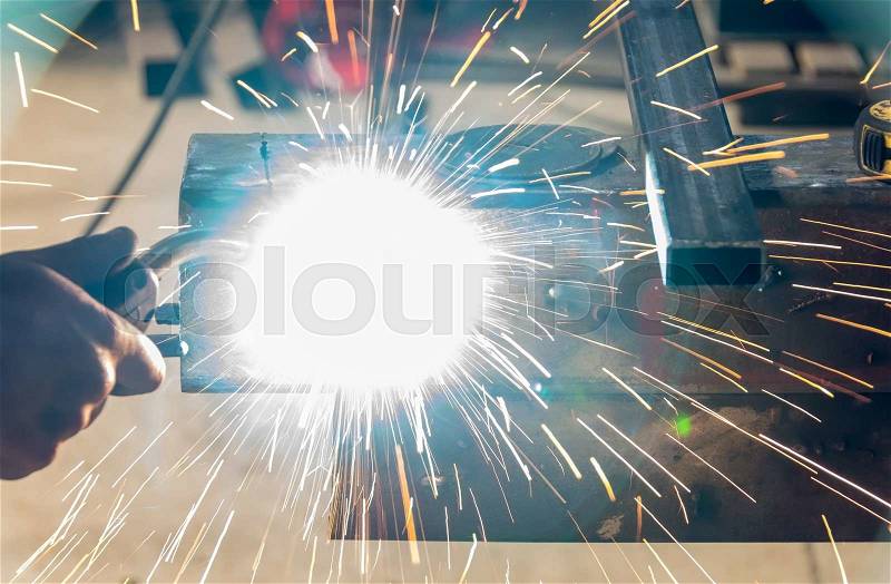 Welder in a metal factory, stock photo