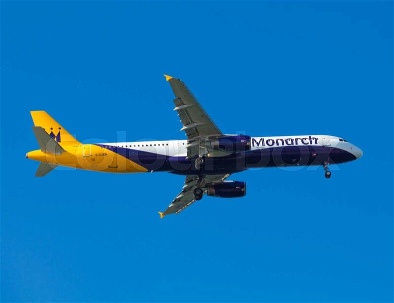 FARO, PORTUGAL - MAY 09 : Monarch Flights aeroplane lands at Faro International Airport, on May 09, 2015 in Faro, Portugal. Monarch is a British airline with 32 jet airliners and 5.8 million passengers in 2010, stock photo
