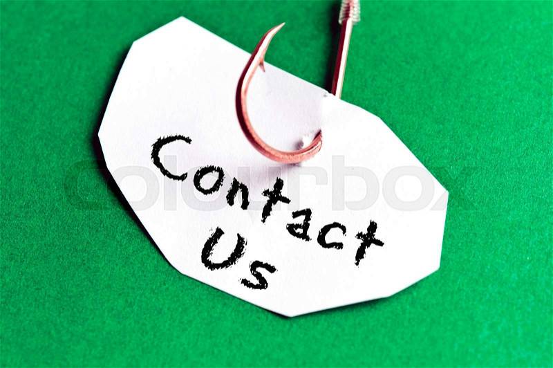 Contact Us message on paper on green background, stock photo