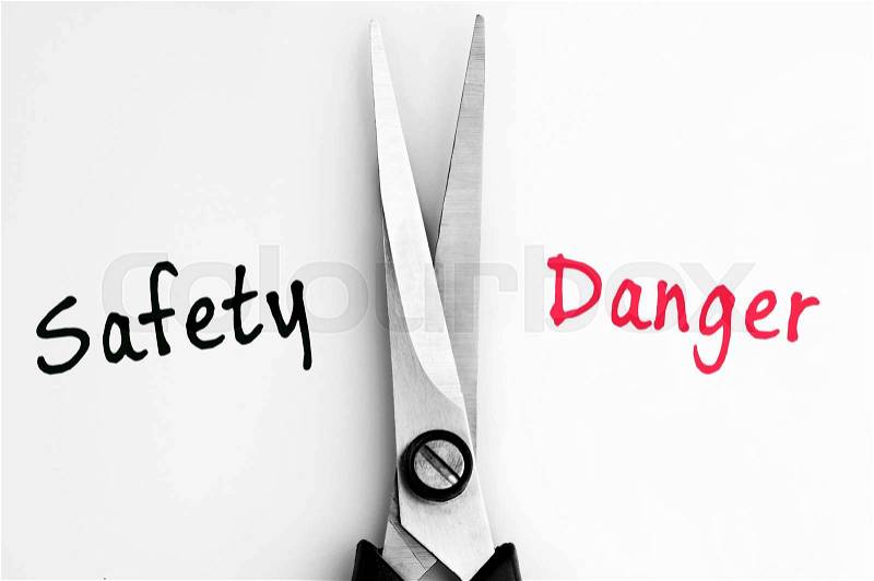 Safety and Danger words with scissors in middle, stock photo