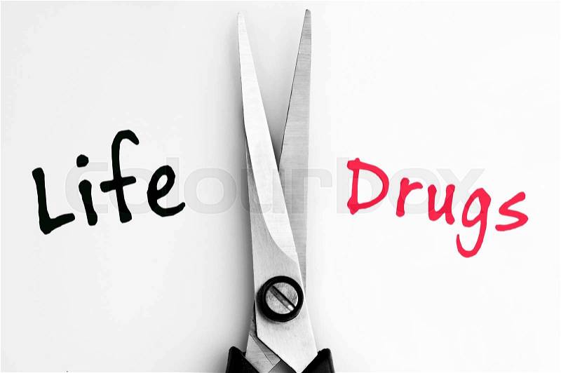 Life and Drugs words with scissors in middle, stock photo