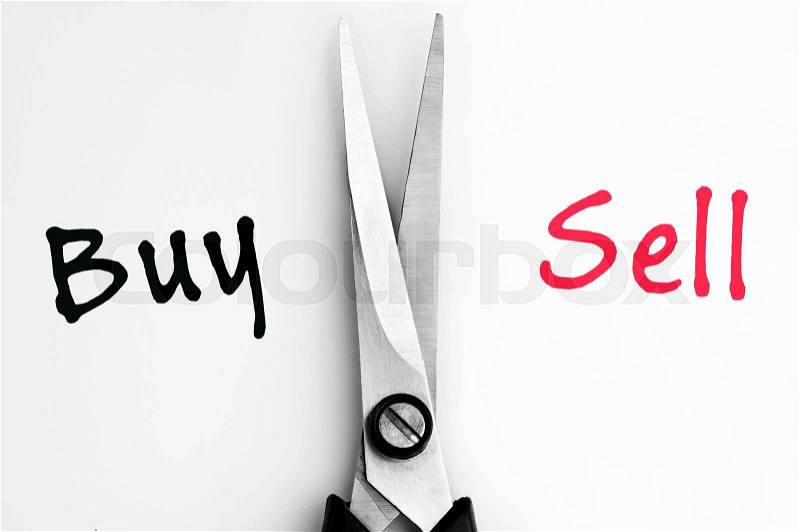 Buy and Sell words with scissors in middle, stock photo