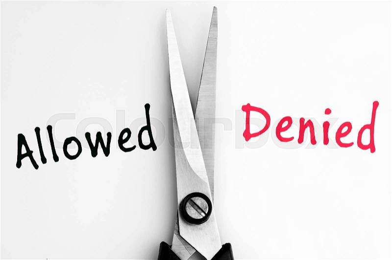 Allowed and Denied words with scissors in middle, stock photo