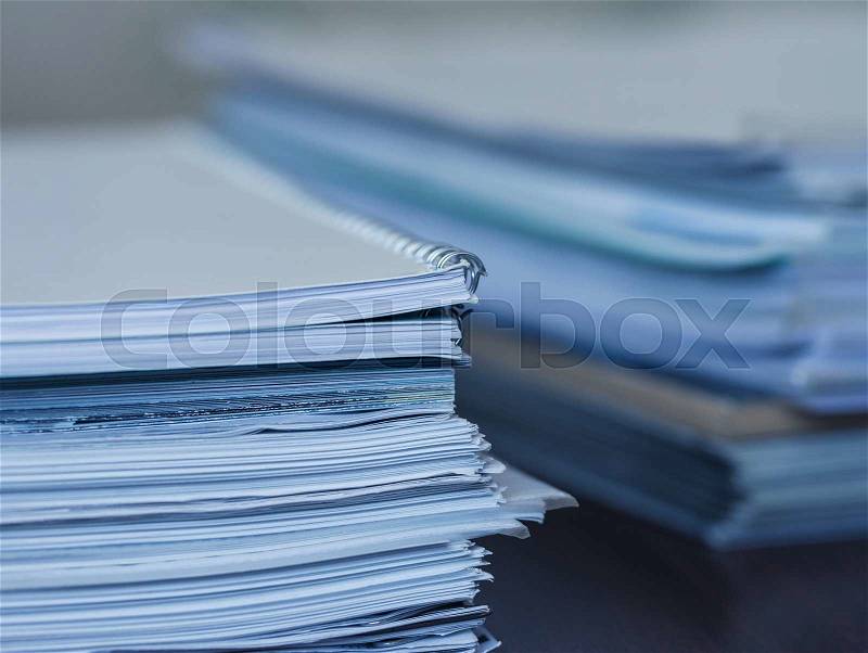Accounting and taxes. Large pile of magazine and books closeup, stock photo
