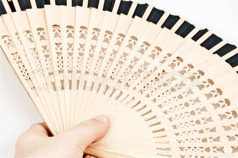 Isolated wooden fan on white background, stock photo