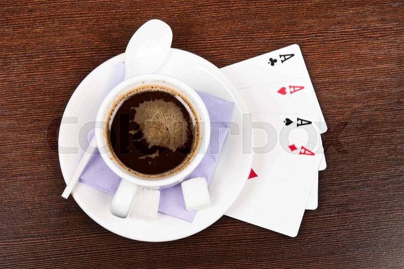 Cup of coffee and ace cards, stock photo