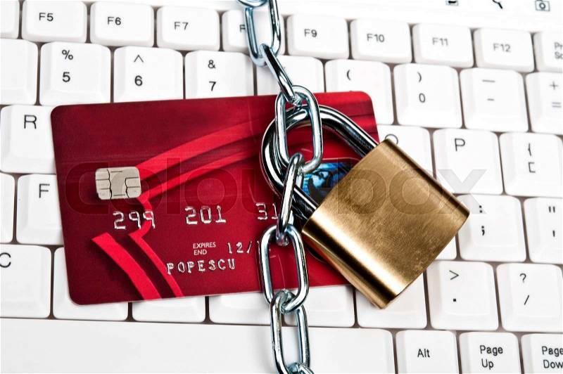 Credit card on an white keyboard, stock photo