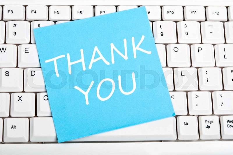 Thank you note on an white keyboard, stock photo