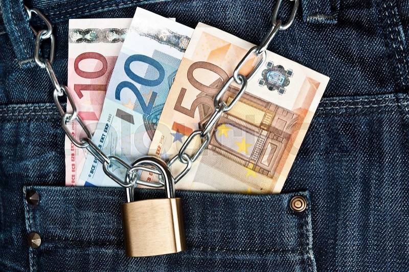 Jeans pocket closeup with money locked, stock photo