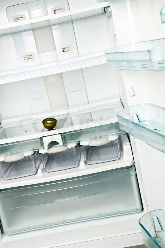 Refrigerator close up with kiwi slice, stock photo