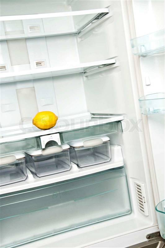 Refrigerator close up with lemon, stock photo
