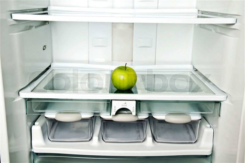 Refrigerator close up with apple, stock photo
