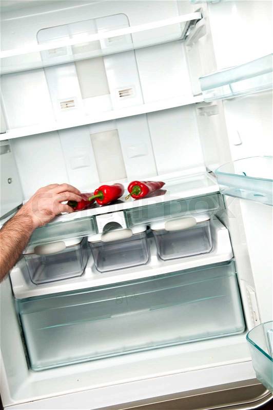 Refrigerator close up with hot red pepper, stock photo