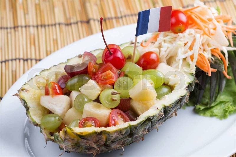 Fruit Salad in Pineapple on the plate, stock photo