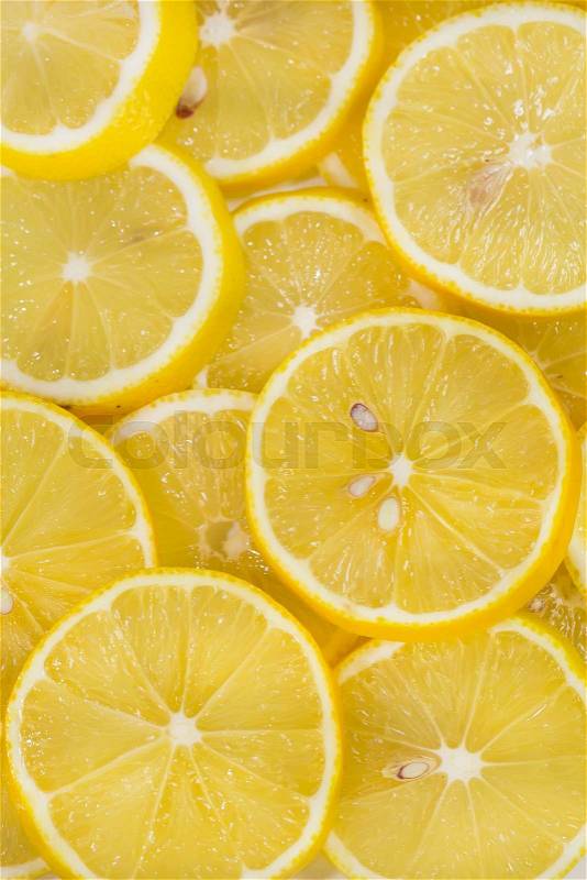 Background of sliced ripe lemons, stock photo