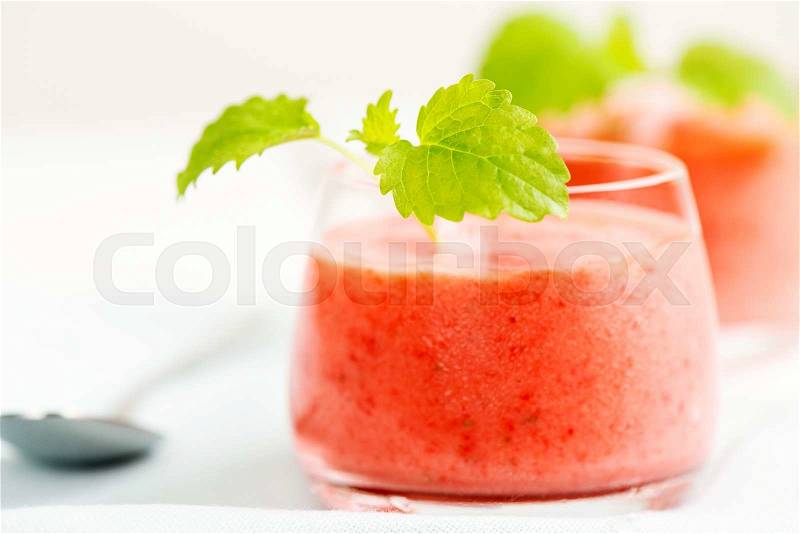 Smoothie drink with mint leafs on table, in high key, stock photo