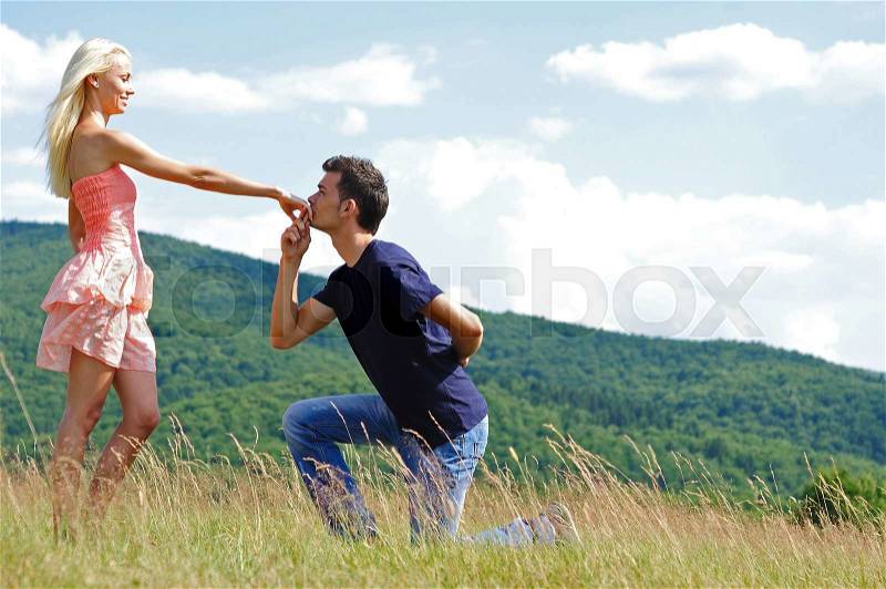 Boyfriend kiss girl hand in nature, stock photo