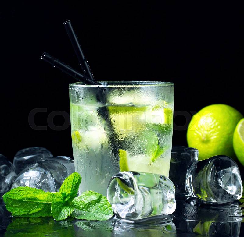 Cold Mojito cocktail with fresh lime, mint and ice, stock photo