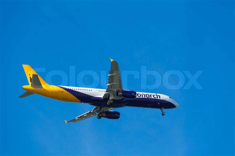 FARO, PORTUGAL - MAY 09 : Monarch Flights aeroplane lands at Faro International Airport, on May 09, 2015 in Faro, Portugal. Monarch is a British airline with 32 jet airliners and 5.8 million passengers in 2010, stock photo