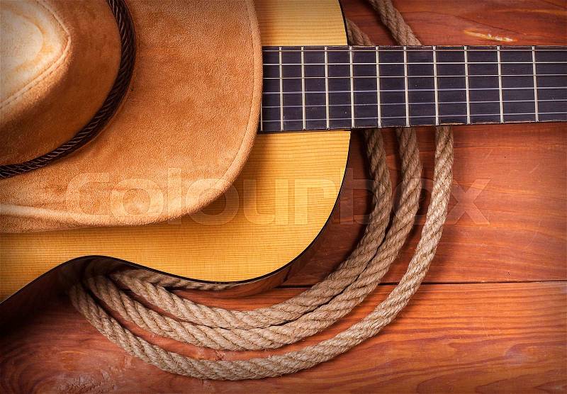 American Country music with guitar and cowboy hat and rope, stock photo