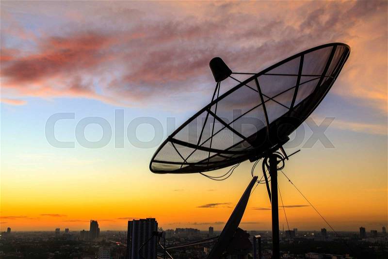 Satellite dish sky in twilight in the city, stock photo