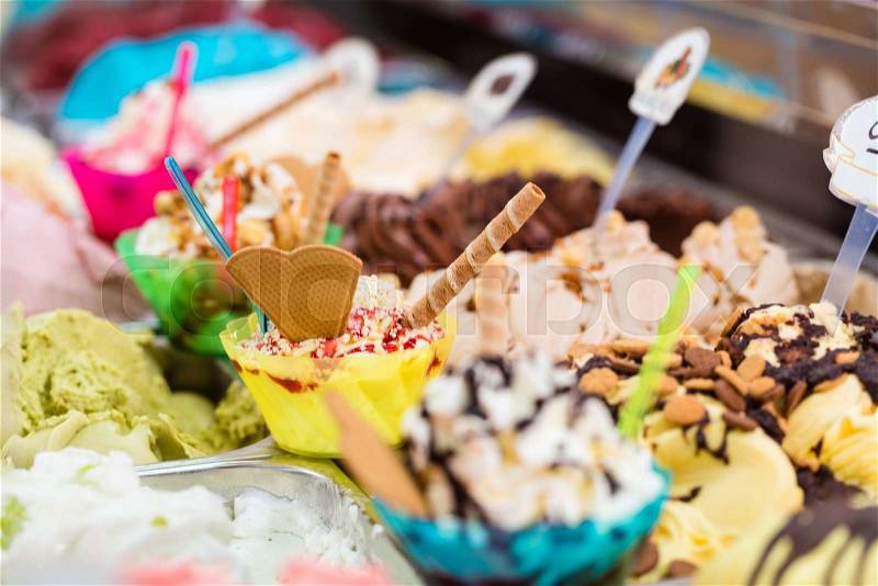 Many different sorts of ice in an ice cream parlor for sundaes and cones, stock photo