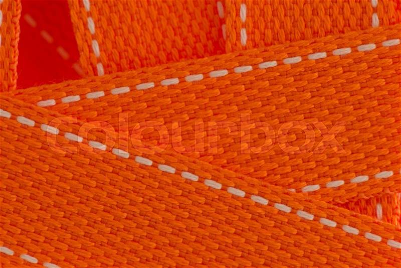 Orange strap belt macro closeup as background, stock photo