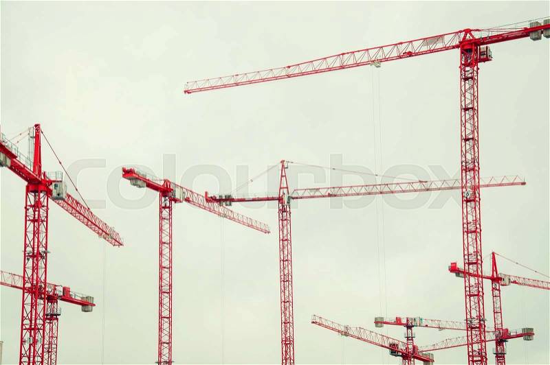 Many red cranes in the sky, stock photo