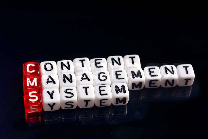 CMS Content Management System written on dices on black background, stock photo