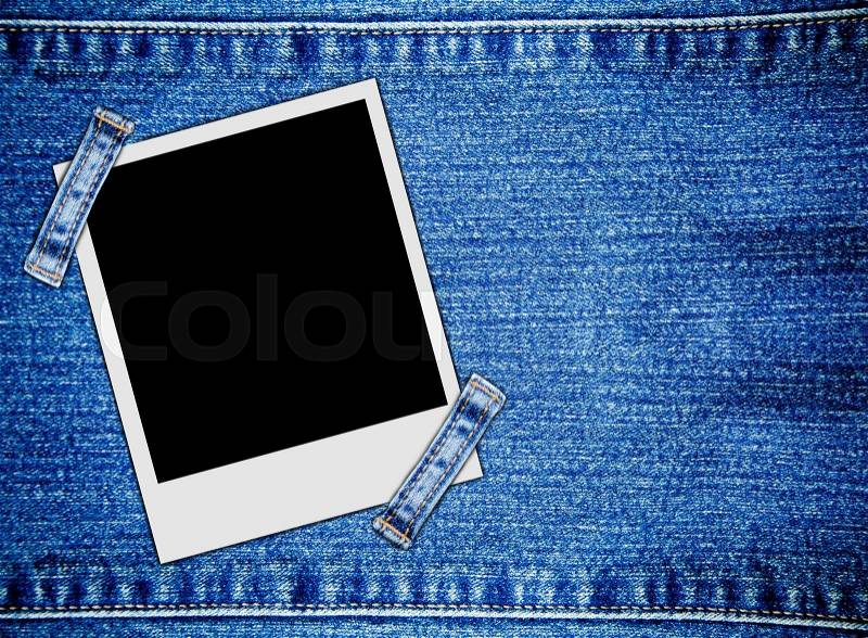 Blank instant photo frames on jeans background, stock photo