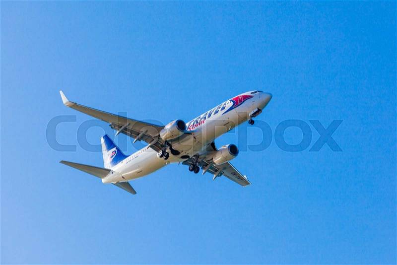 FARO,PORTUGAL-MAY 09: Trave Service Boeing B737 lands at Faro International Airport, May 09, 2015 in Faro, Portugal. Travel Service is the largest private airline company in the Czech Republic, stock photo