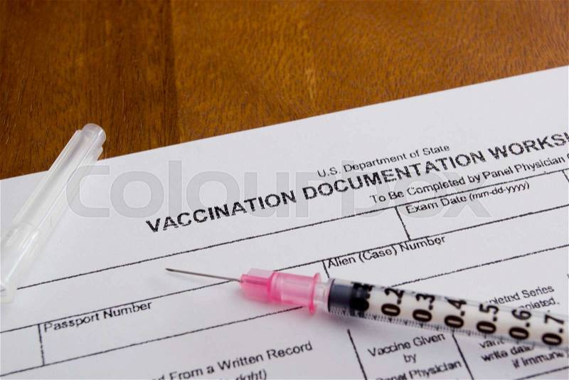Filling in the form of vaccination. Medical records, stock photo